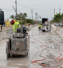 Crews are cutting the bridge deck and traffic rail.